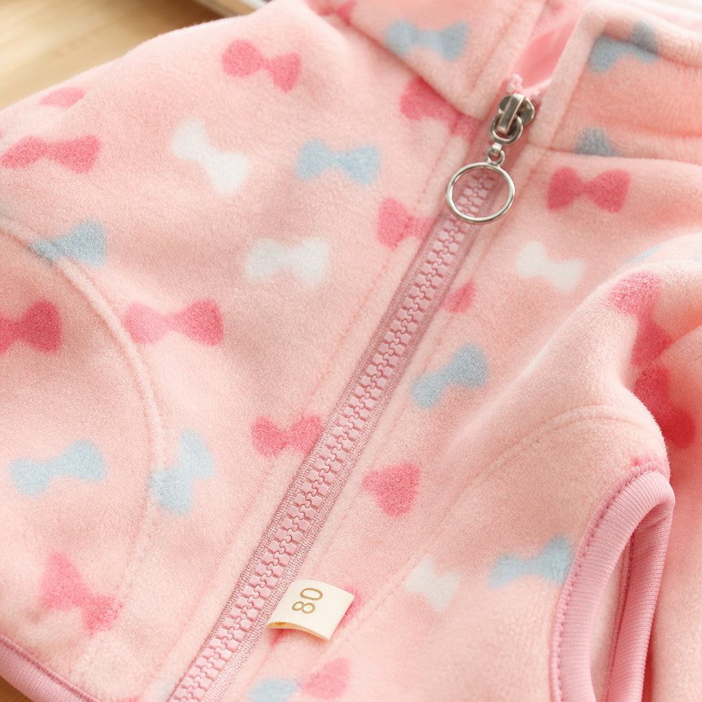 Girls' zip-up jacket detail showing full-length front zip